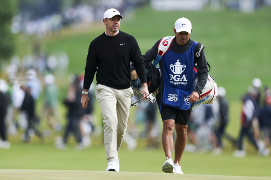 Rory McIlroy a jeho caddie Harry Diamond (foto: Getty Images).