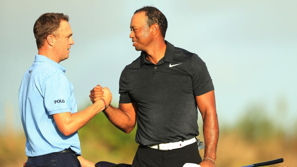 Justin Thomas a Tiger Woods